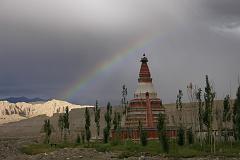 
The Serkhang chorten in Tholing is bathed in an evening rainbow.
